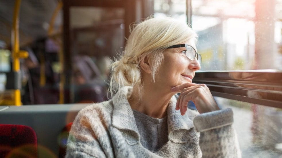 Senior woman staring out of window